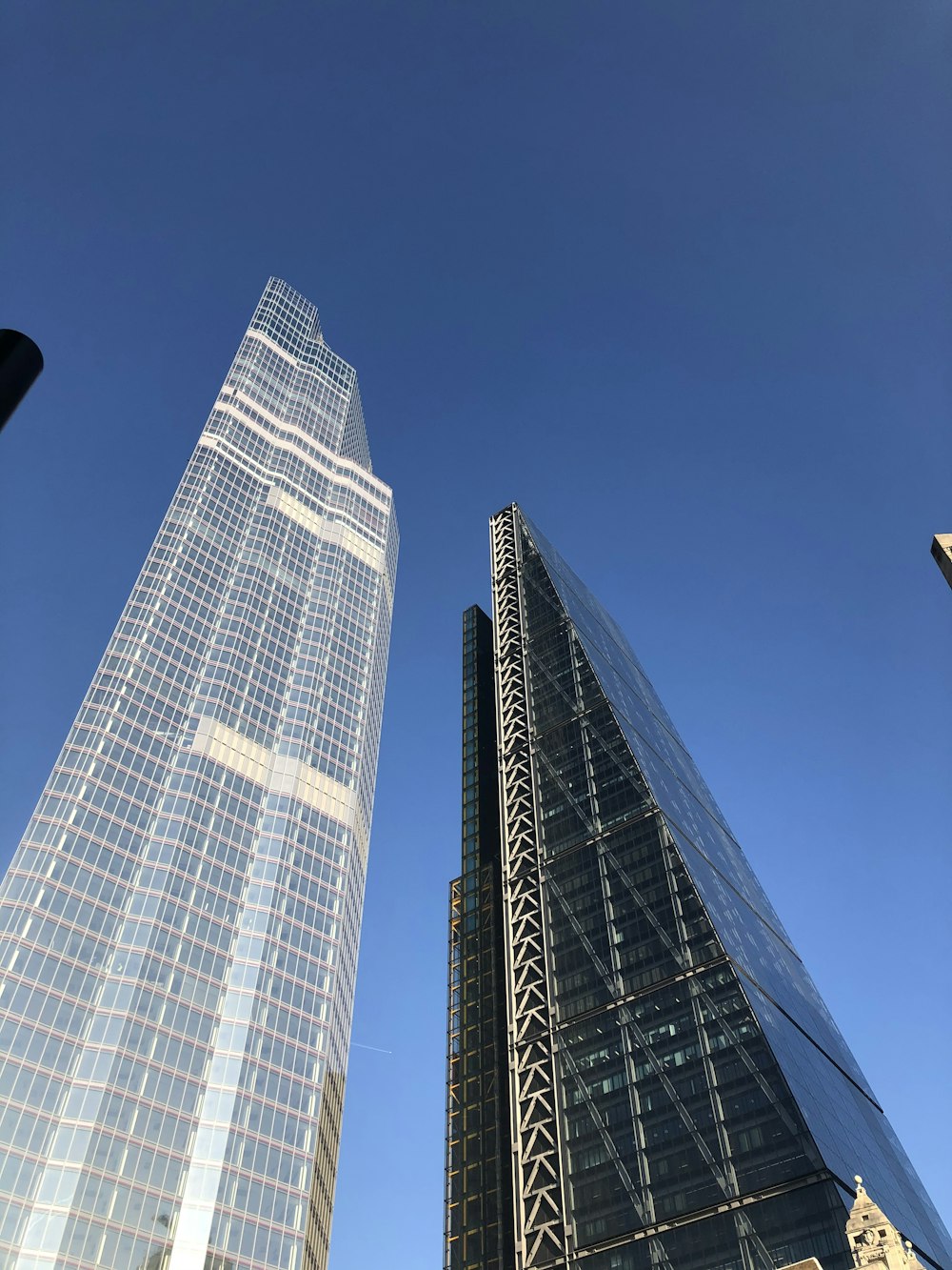 low-angle photograph of two high-rise buildings