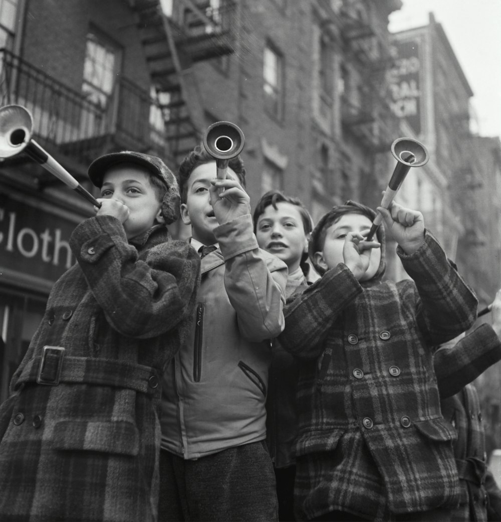Blowing horns on Bleeker Street on New Year's Day. 