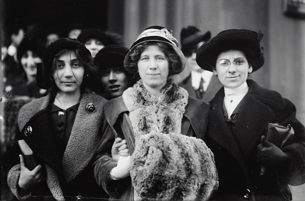 A historical photograph of women surgeons in the early 20th century.