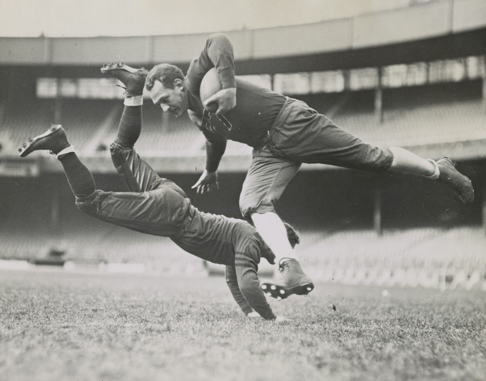 Vintage black and white photograph of football players during a 1935 practice