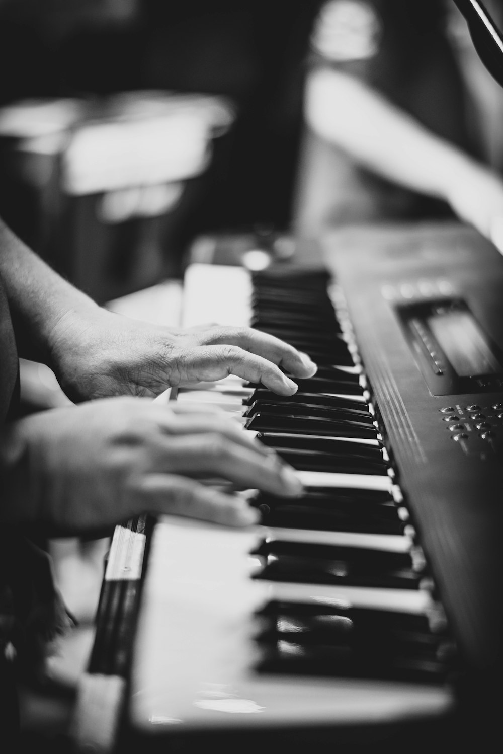 person playing electronic keyboard