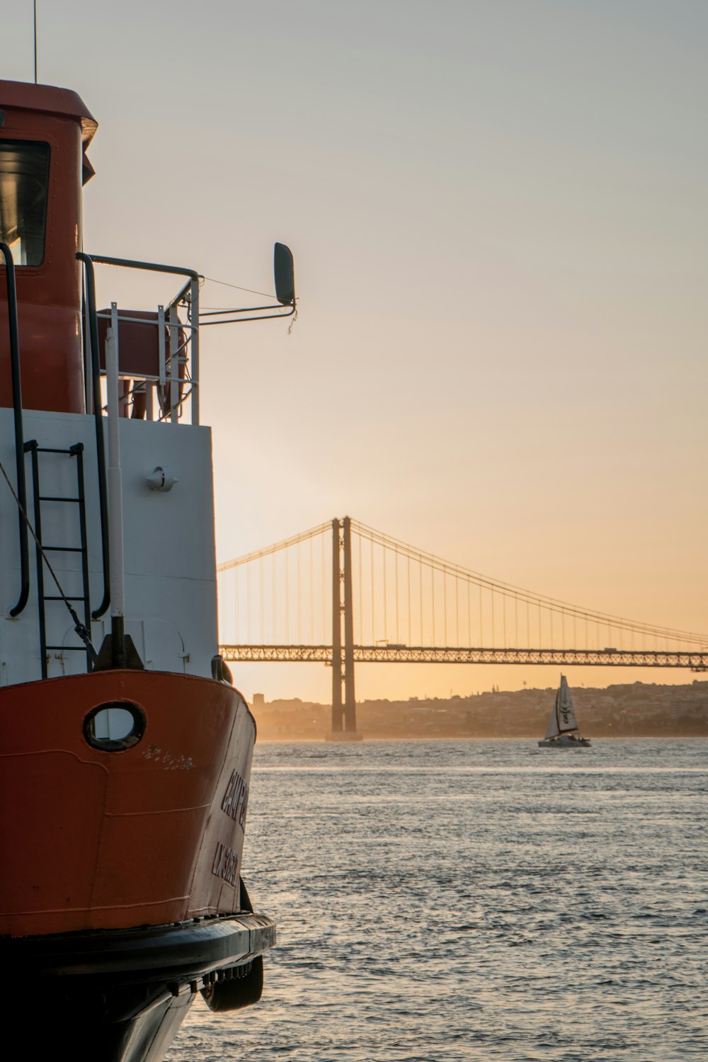 white and orange ship photograph