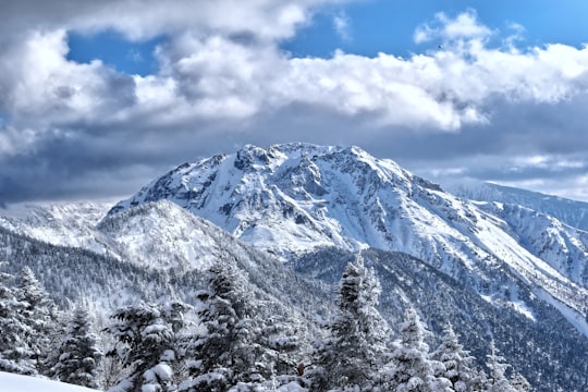 aerial photography of a snowy mountain during daytime in Takayama Japan