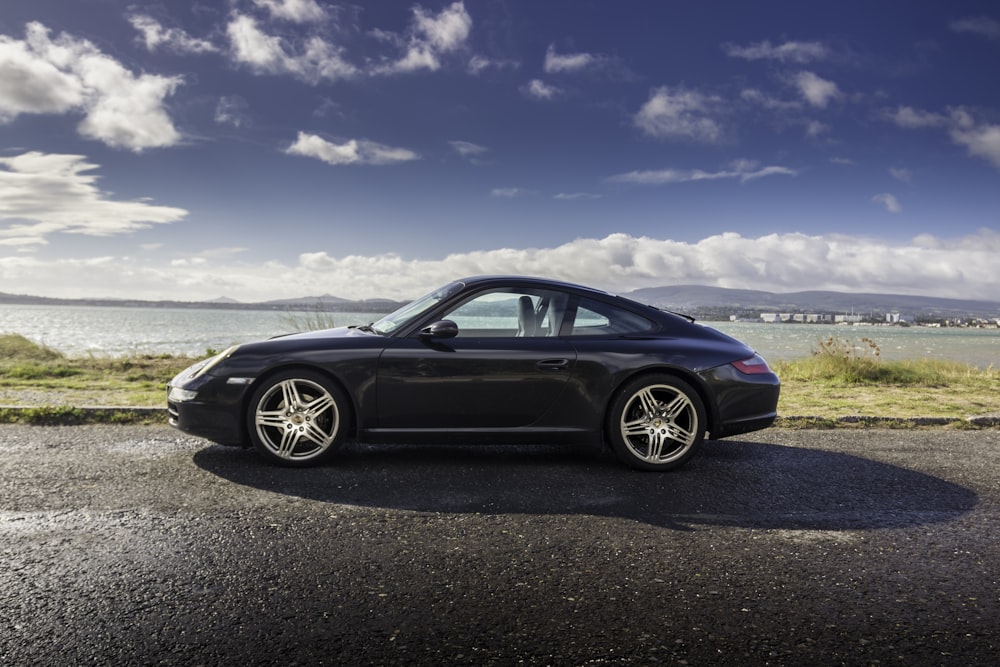 black coupe in an asphalt road