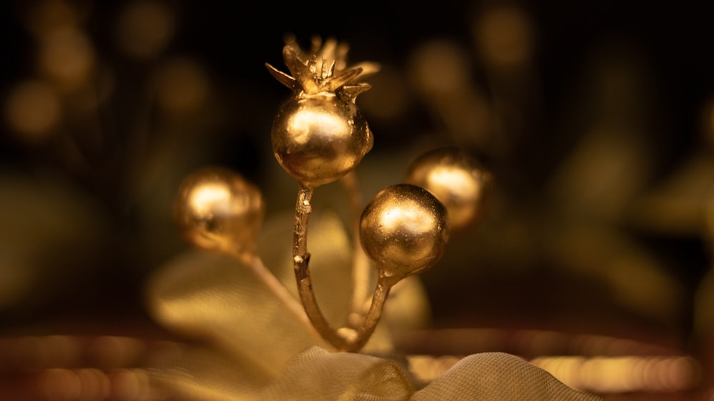 shallow focus photo of gold-colored table ornament