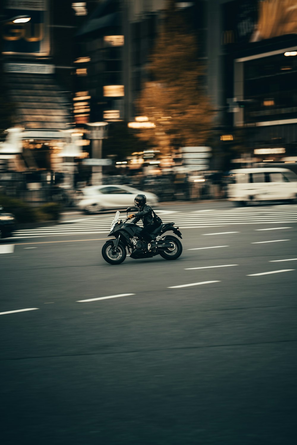 photography of person riding motorcycle