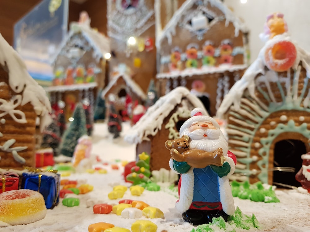 Santa figure beside Gingerbread houses