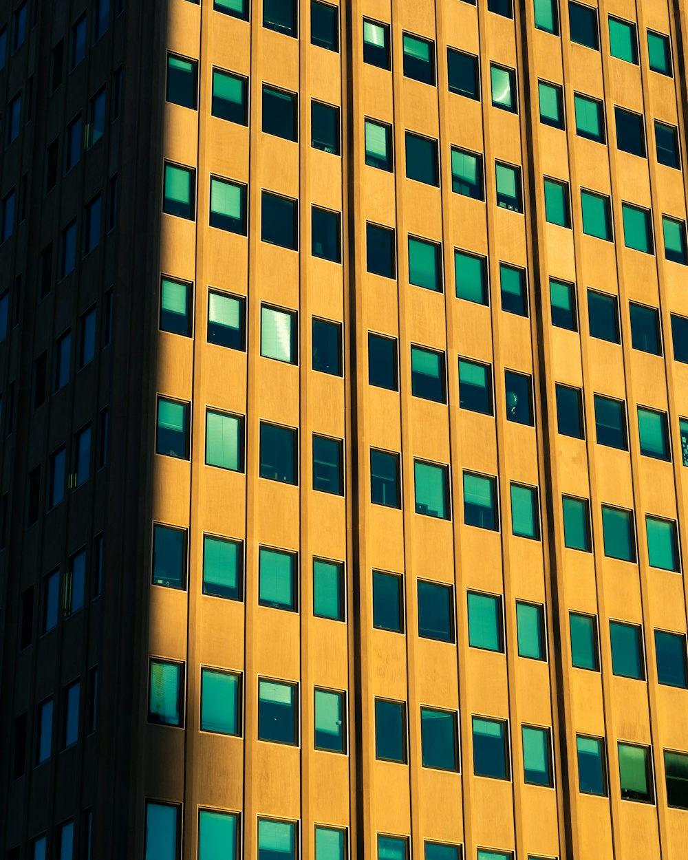 brown concrete high-rise building during daytime