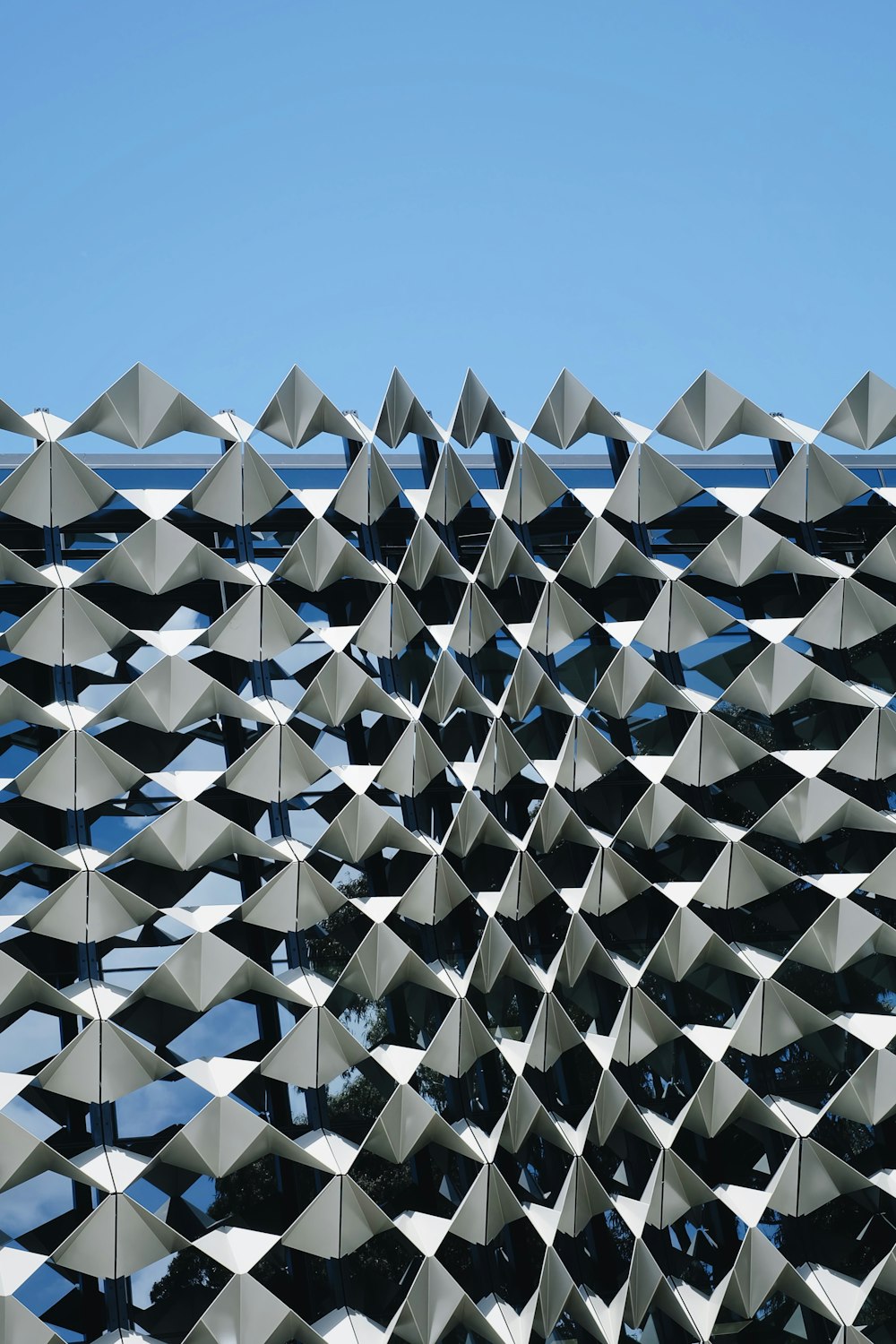 a large metal structure with a sky background