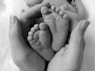 person holding baby's feet