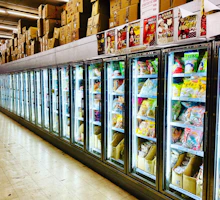 Refrigeration units maintaining optimal temperature in a food storage warehouse.