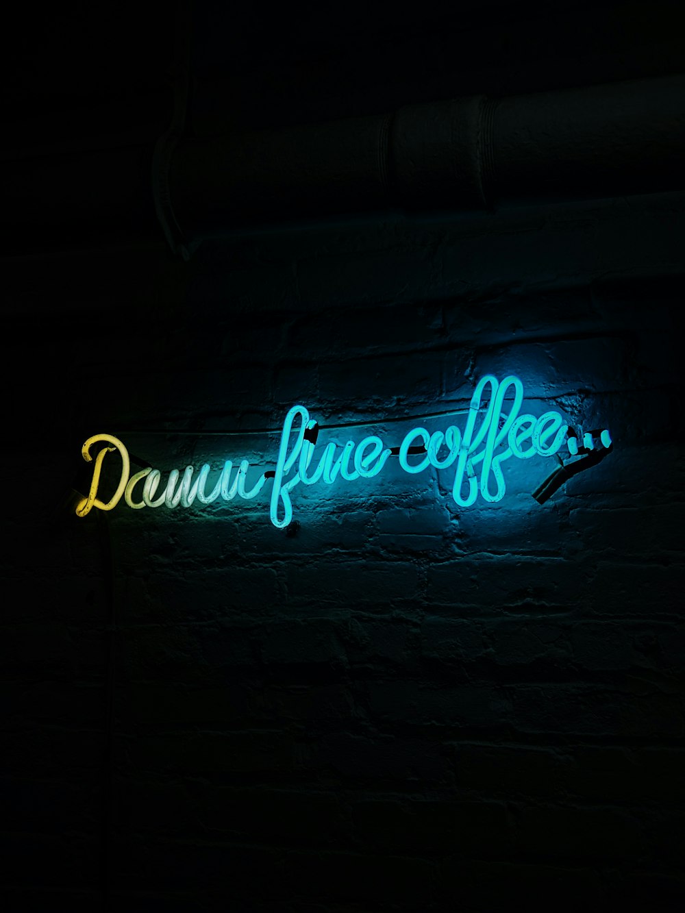 a neon sign that reads, donut fine coffee