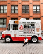 woman leaning on food truck