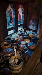 brown pots placed by the window