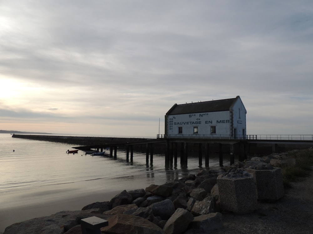 white building near body of water