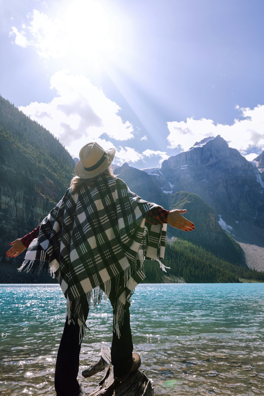 woman spreading her arms on water