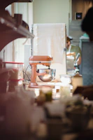 a kitchen scene with focus on the mixer