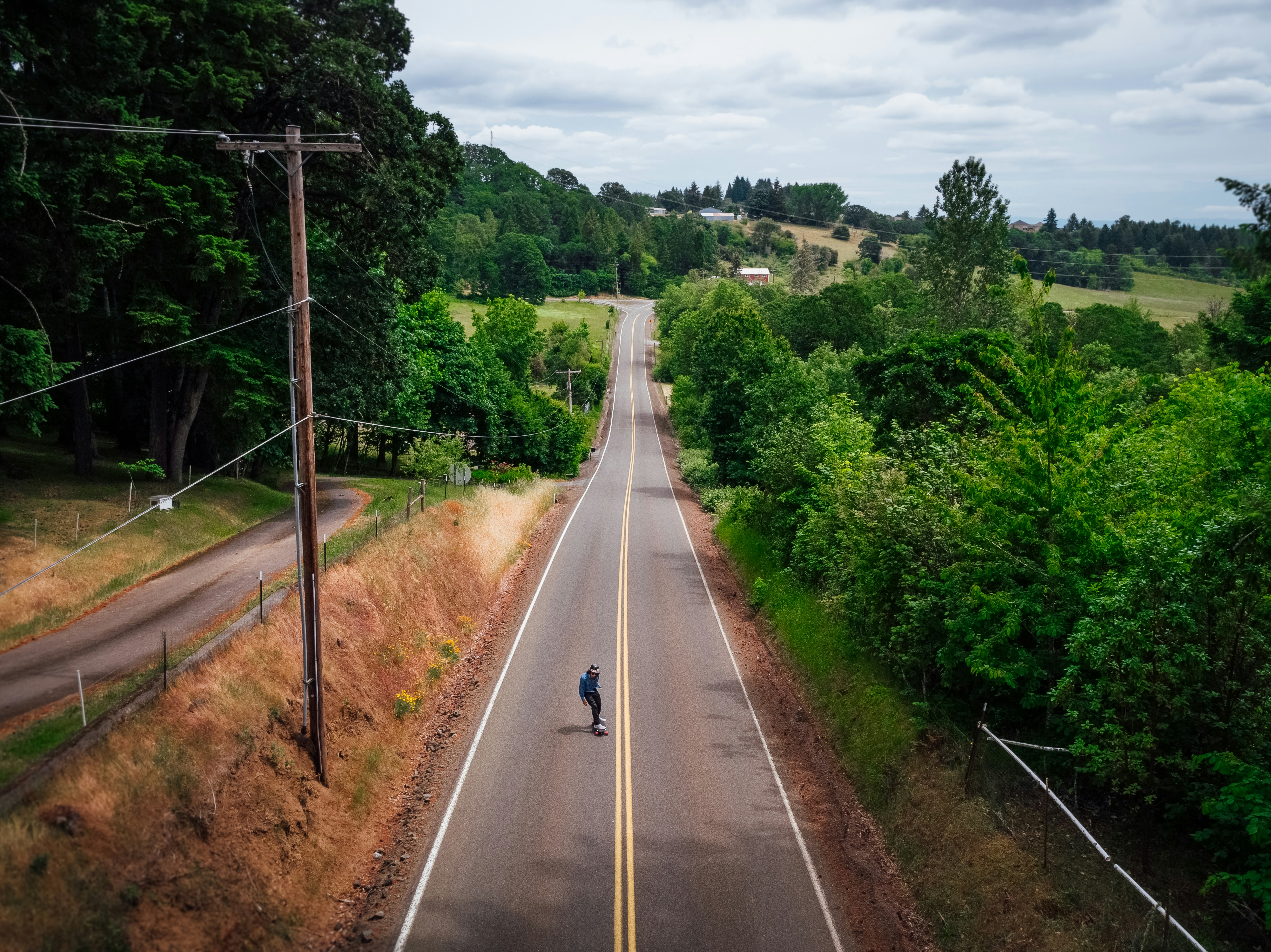 man skating on road