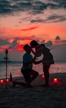couple kissing on shore