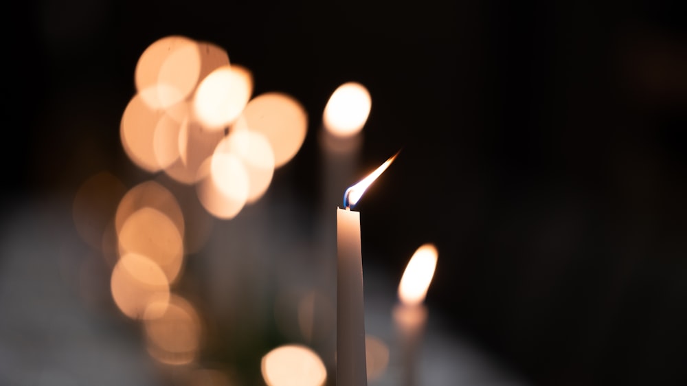macro photography of lighted candlestick