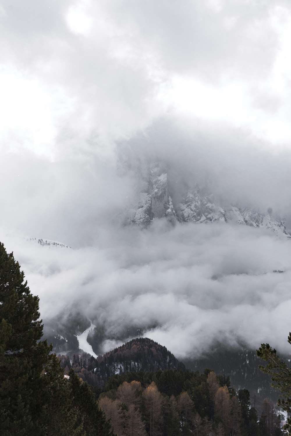 aerial photography of mountain in foggy day