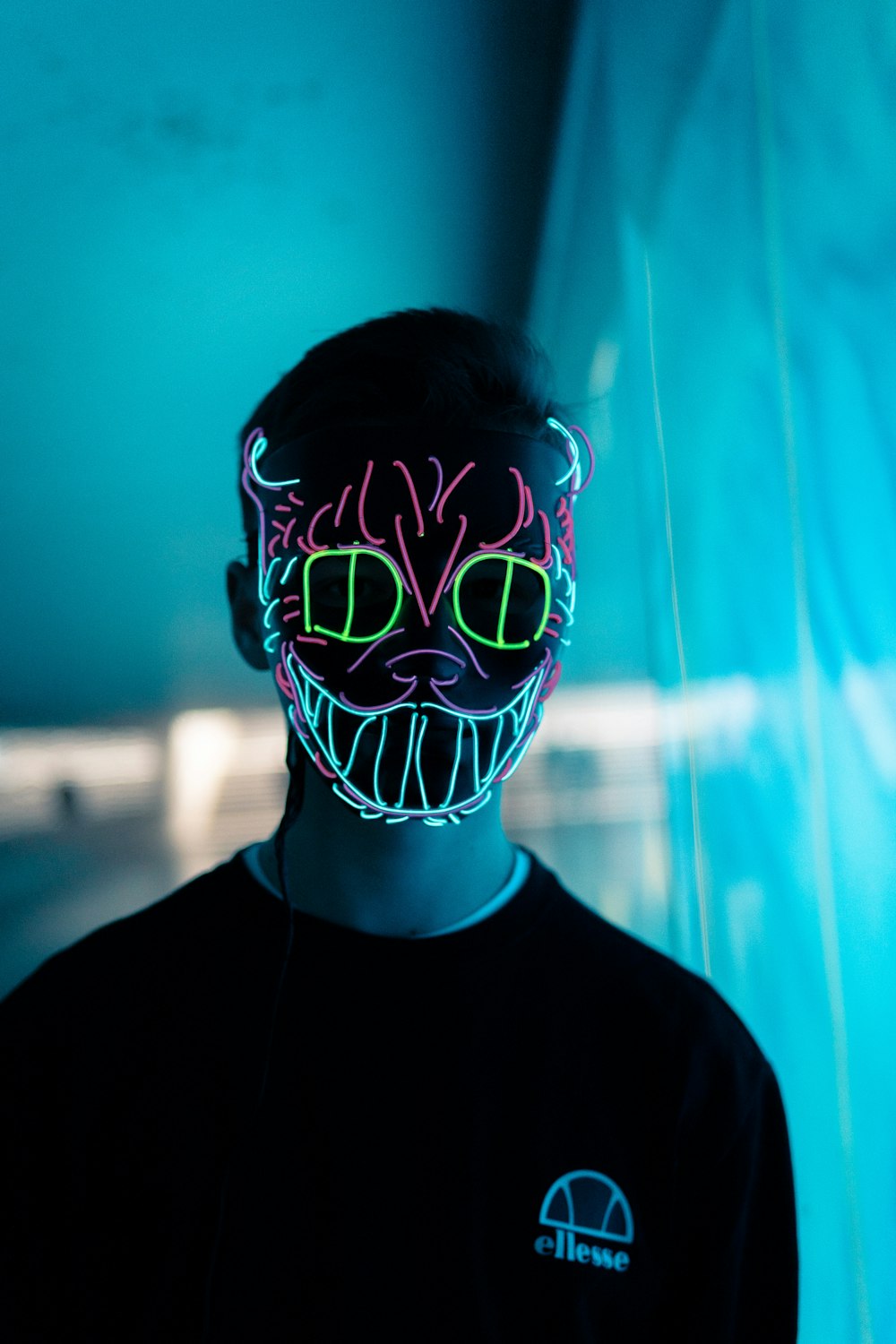 Man Wearing Green And Red Cat Neon Mask Photo Free Light Image On Unsplash