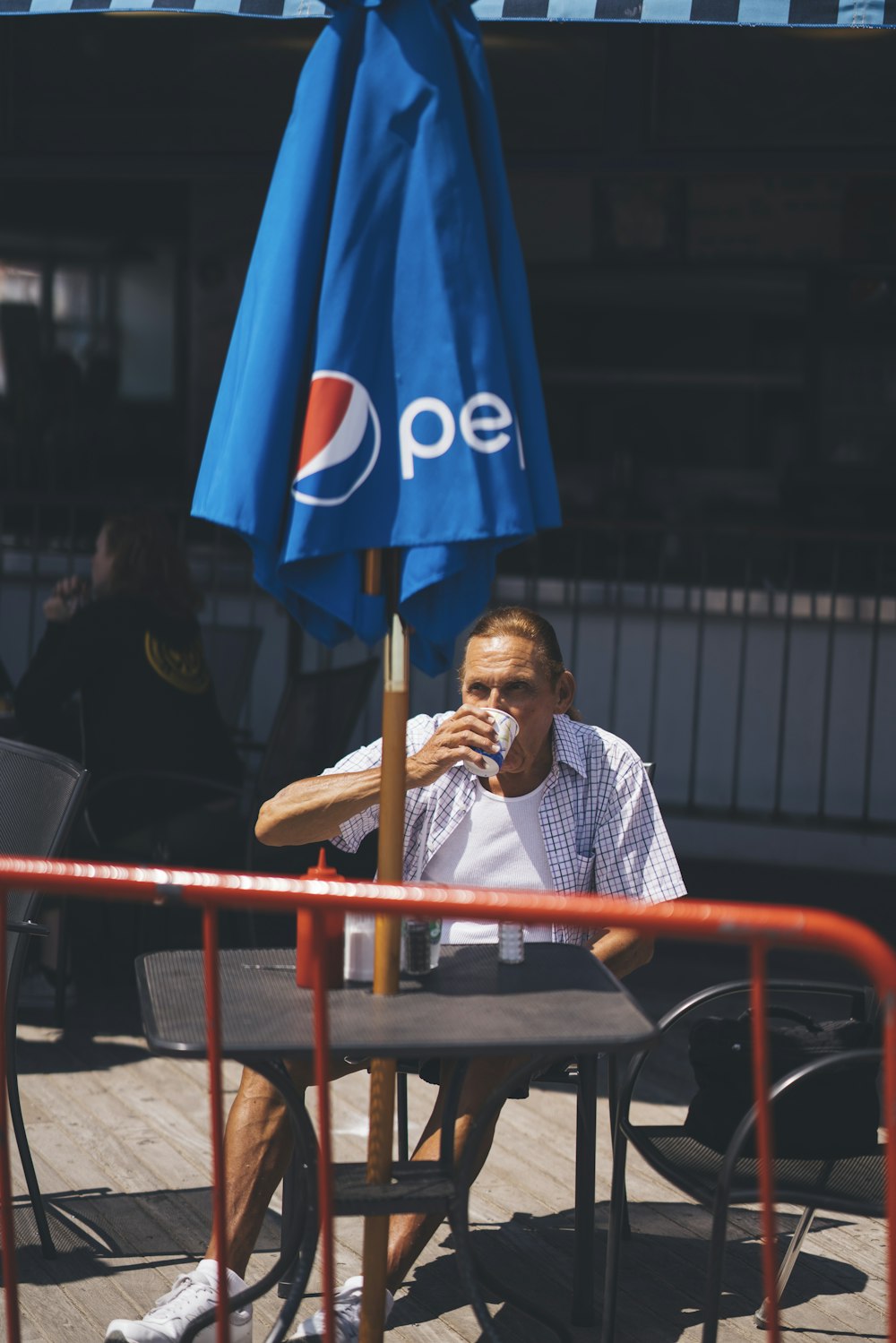 man drinking from a cup