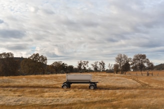 a truck is parked in the middle of a field