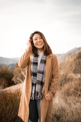 woman wearing a brown coat