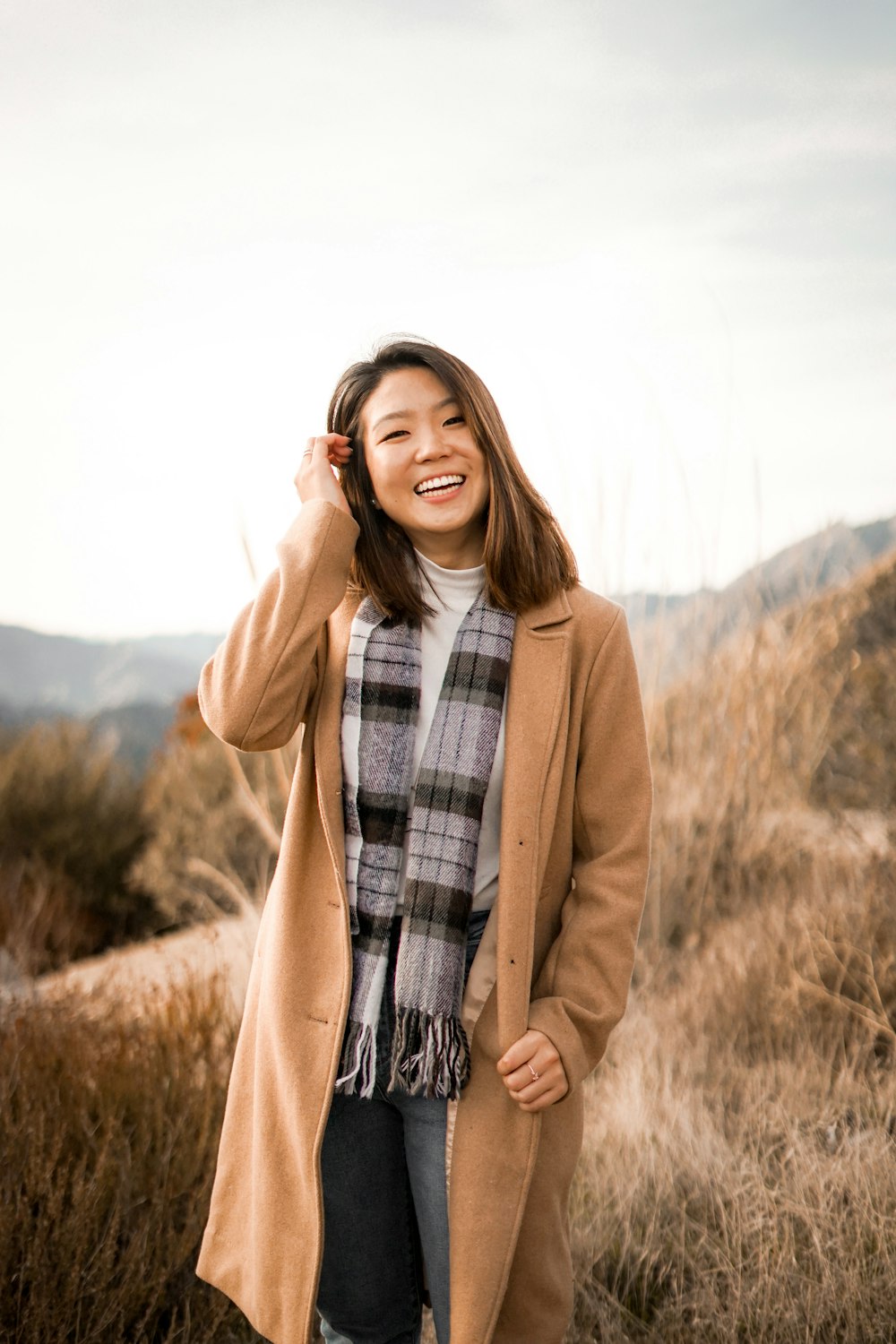 woman wearing a brown coat