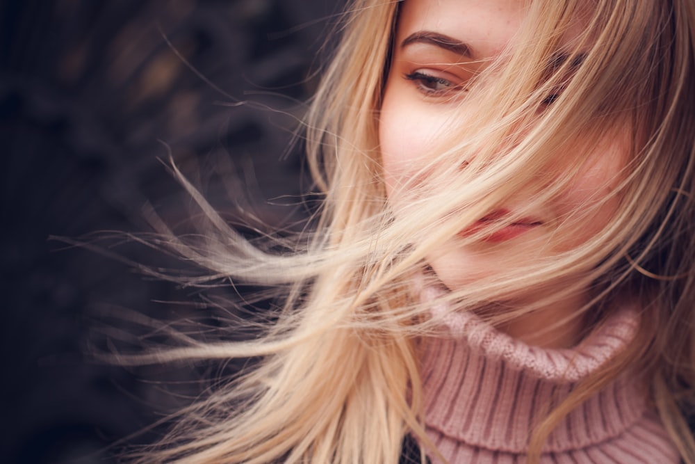 woman wearing pink knit jacket