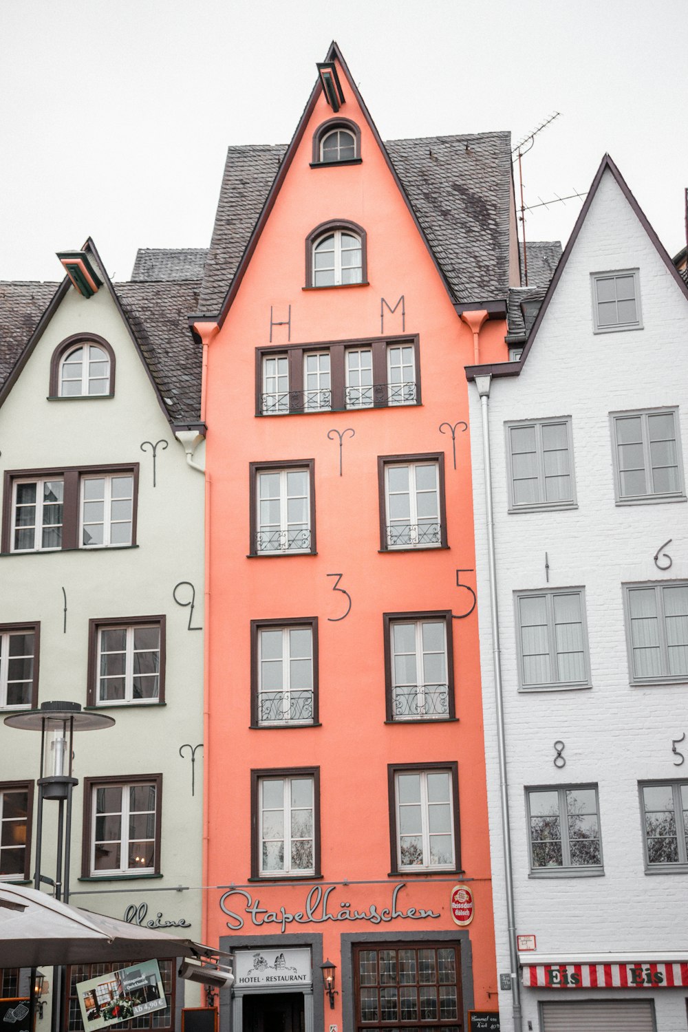 white and orange building during daytime