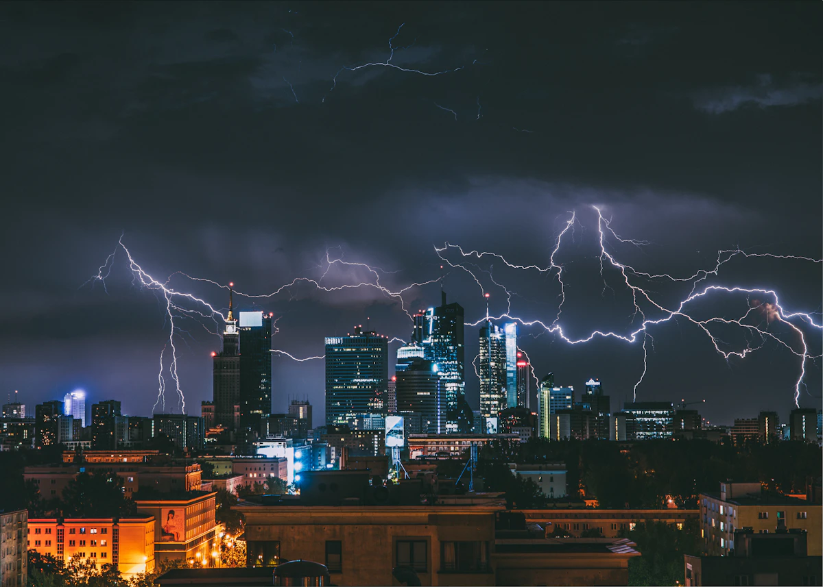 Storm clouds gathering over a city skyline
