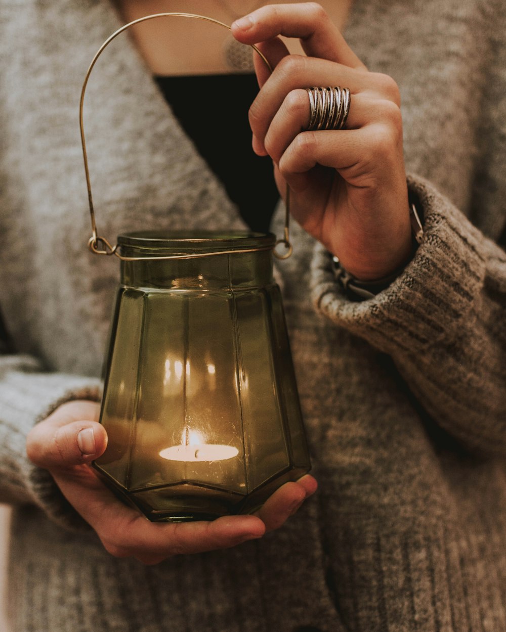 woman holding tealight