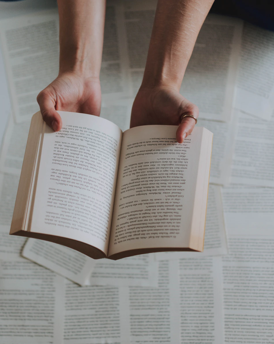 A reader holding a printed book
