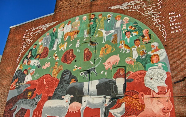 A colorful mural depicting love for animals and children.