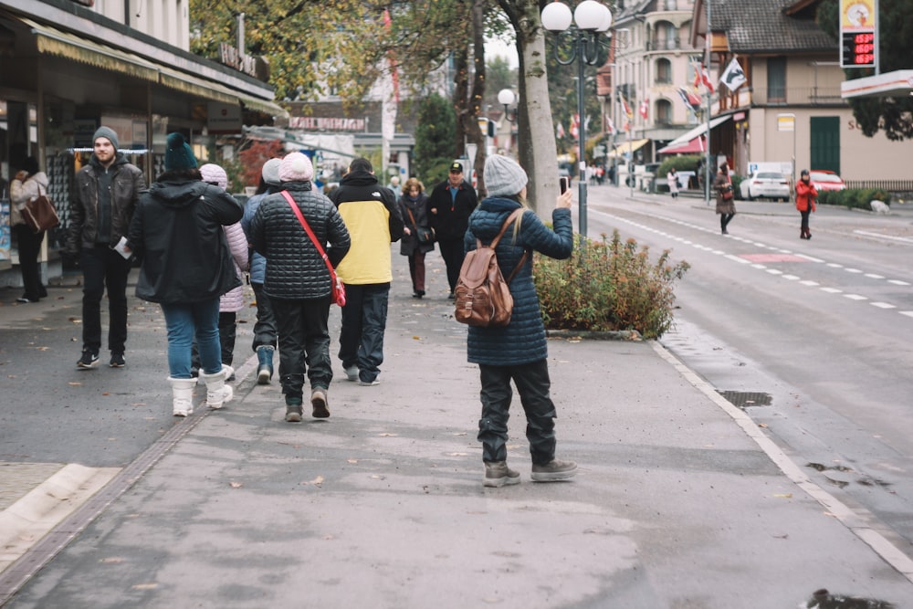 people on roadside at daytime