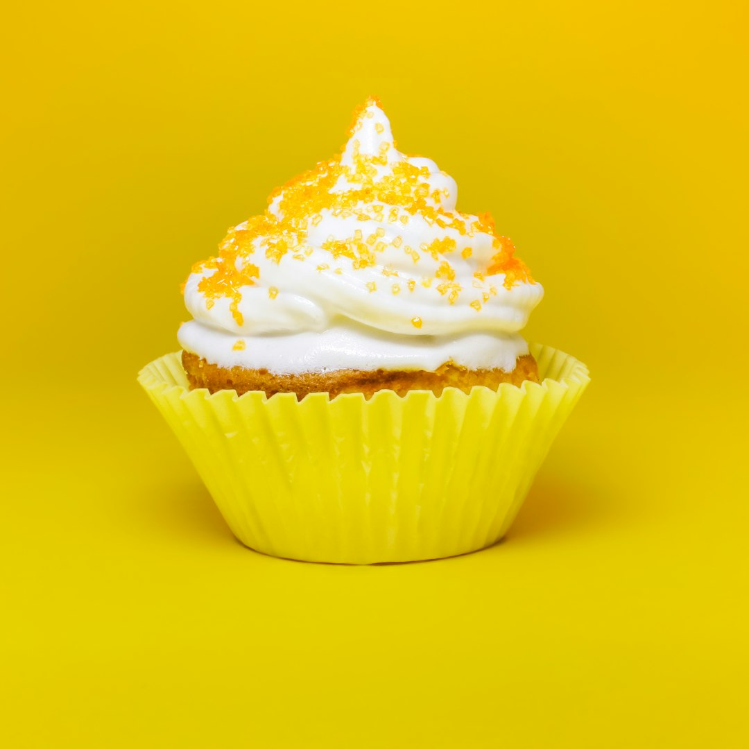 cupcake top with cream in yellow cupcake holder