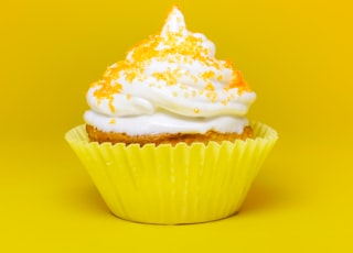 cupcake top with cream in yellow cupcake holder