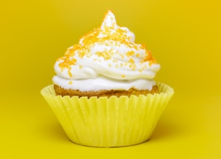cupcake top with cream in yellow cupcake holder