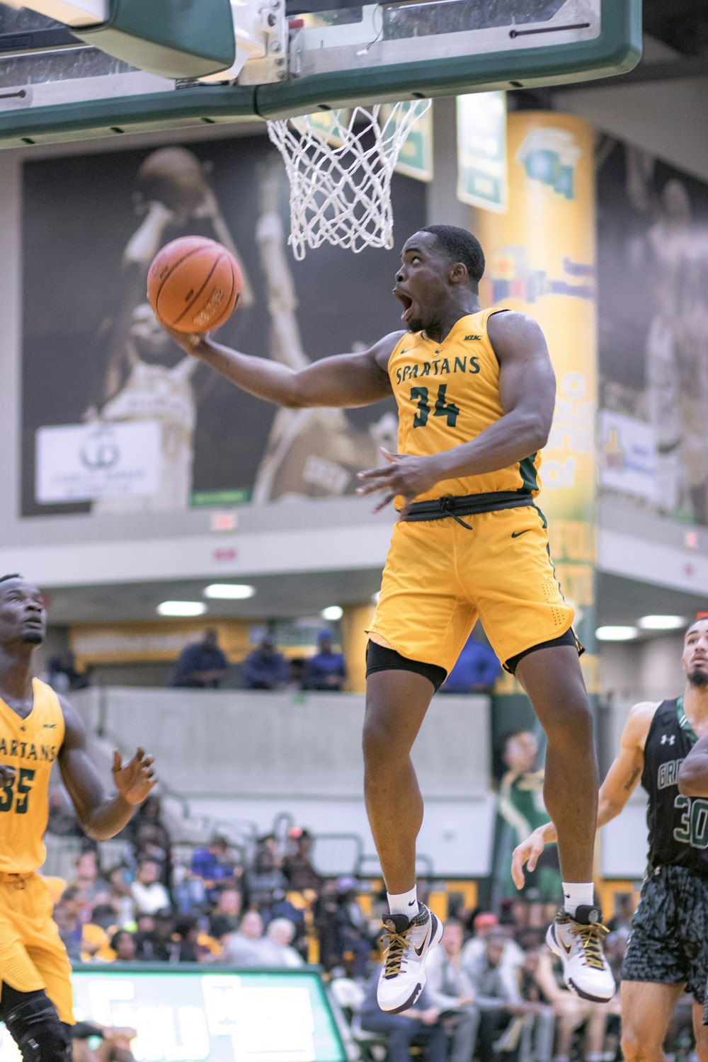 shallow focus photo of man playing basketball