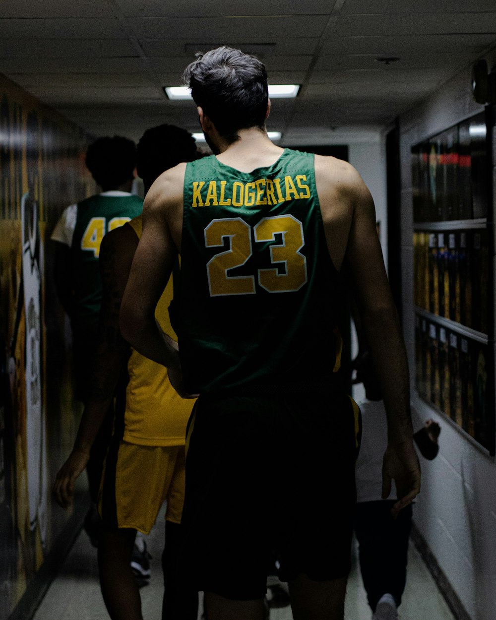 shallow focus photo of man in green Kalogerias 23 jersey