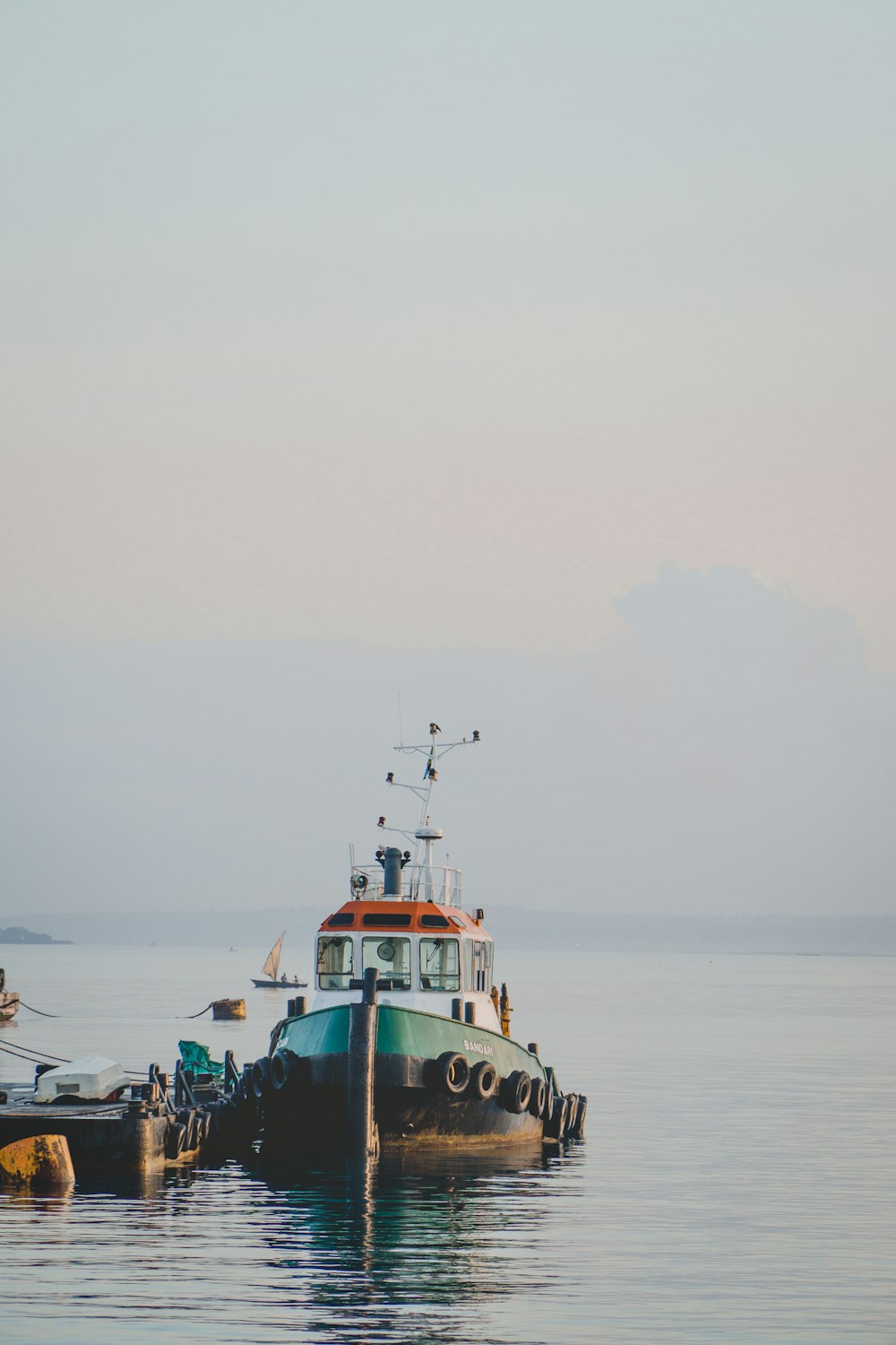 green and white boat