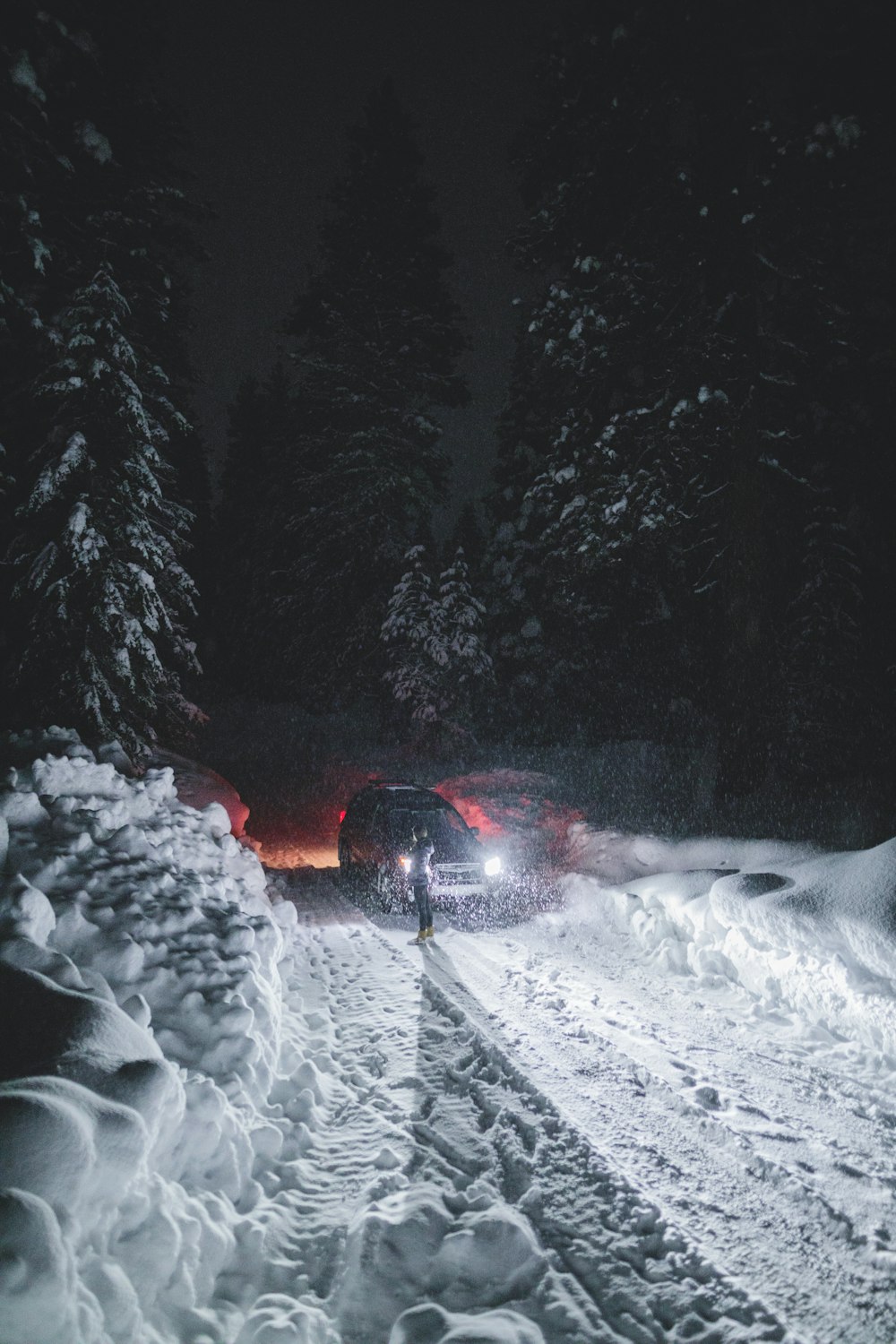 parked vehicle on snow at night