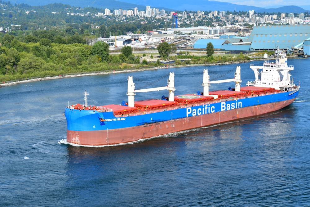 blue and red Pacific Basin cargo ship