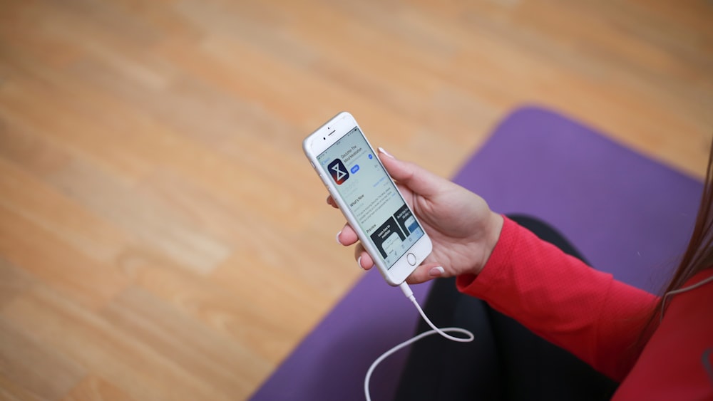 woman holding iPhone