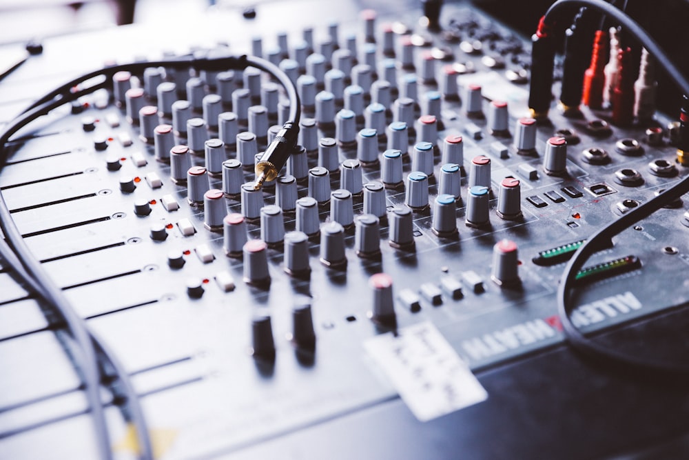 selective focus photography of gray audio mixer