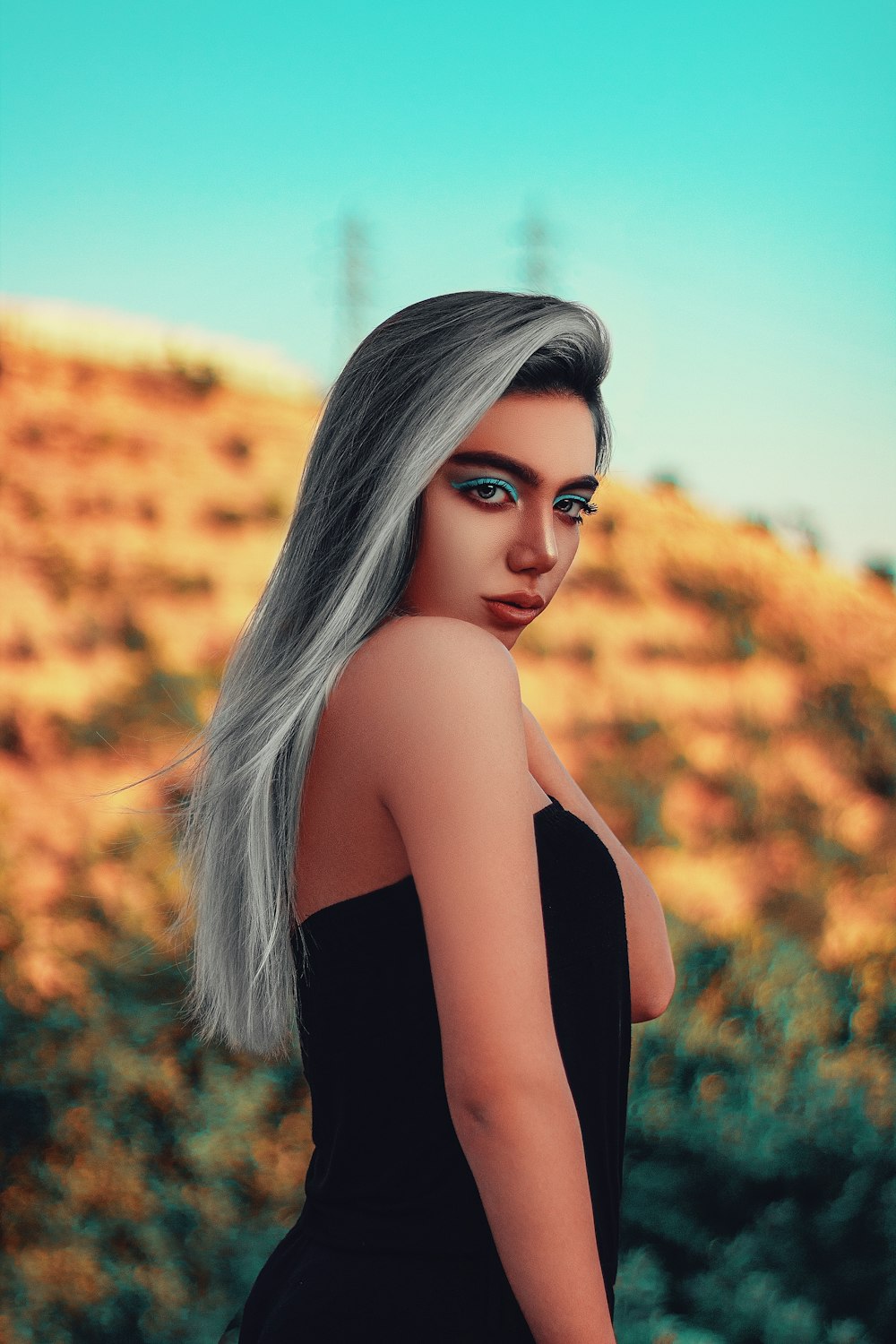 shallow focus photo of woman in black strapless top