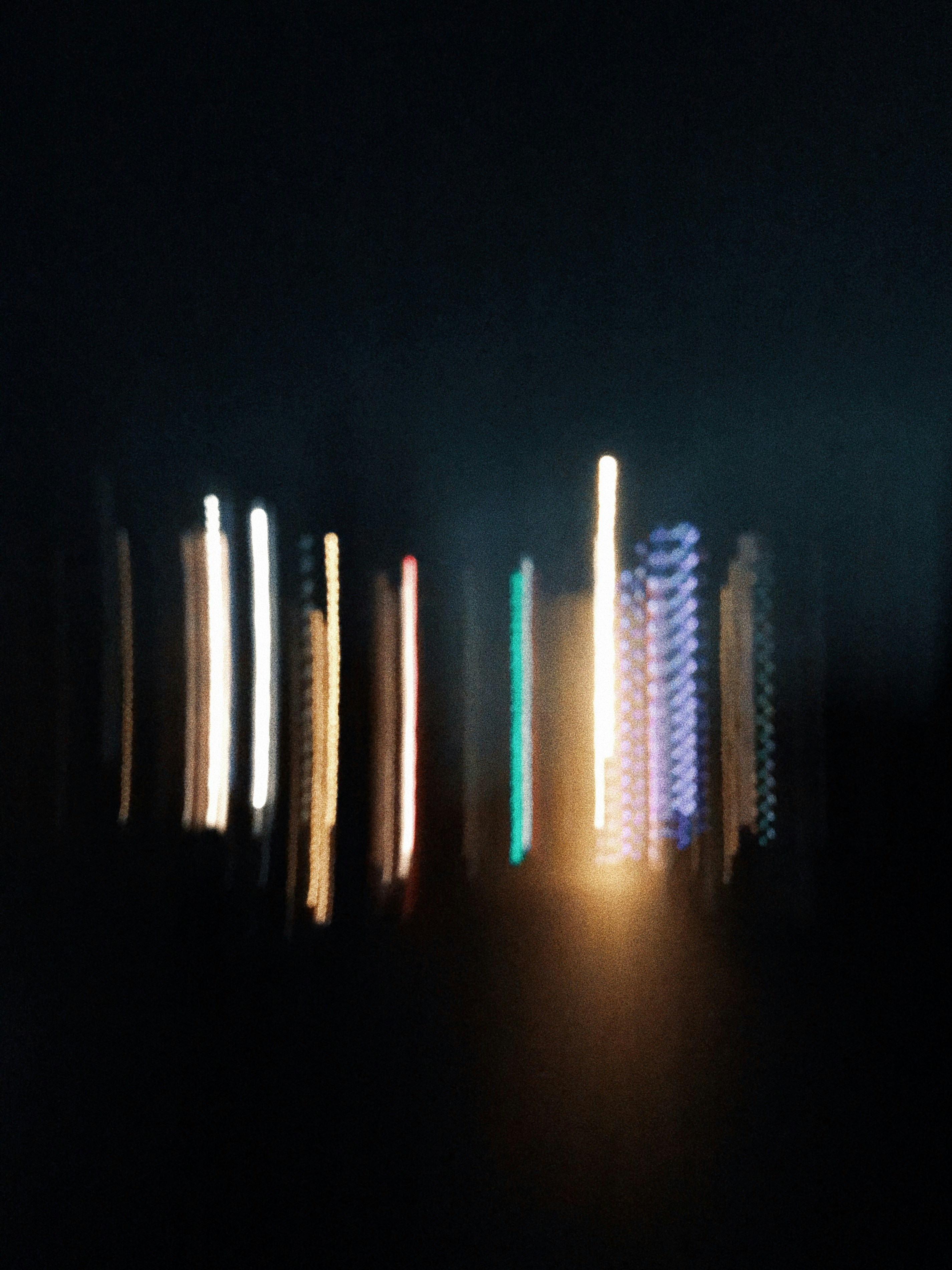 a blurry photo of a street light at night