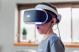 A vibrant classroom where students are immersed in VR headsets, engaging with interactive game development projects.